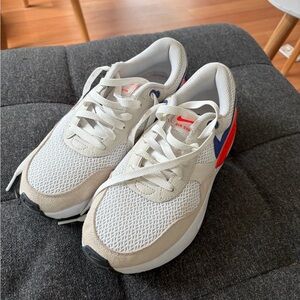 Nike Women's White Sneakers with Blue and Red Accents